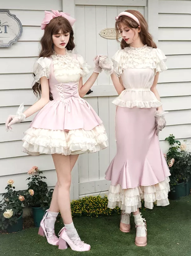 Sweet lolita two-piece dress sets with matching off-white lace crop tops and pink skirts worn by two models