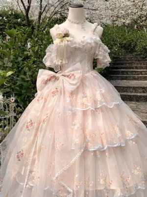 Sweet lolita wedding dress medium front view showcasing lace-trimmed off-shoulder design, large statement floral bow at bodice, and layered tulle skirt with decorative details