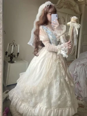 Sweet Lolita wedding dress side mirror view bridal veil long lace sleeves flowy layered skirt magic wand held by model