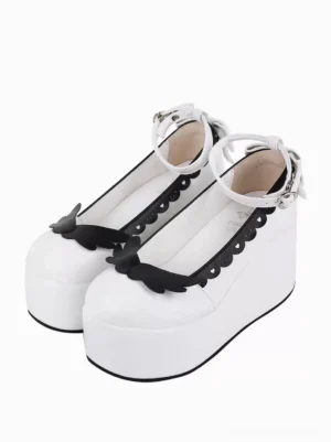 Sweet Lolita white butterfly platform pumps front three-quarter paired display showing round toe black butterfly decoration scalloped trim ankle strap with bow details