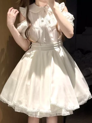 Sweet lolita dress white front close-up detail showing peter pan collar pleated bodice and cold-shoulder puff sleeves against dark background