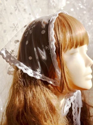 Sweet lolita white lace headdress with snowflake print right side profile view on mannequin with brown bangs wig sheer mesh polka dots crochet lace trim chin ties