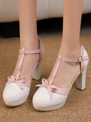 Sweet Lolita white and pink T-strap platform pumps with bow embellishment worn on model feet with scalloped collar and chunky heel overhead view