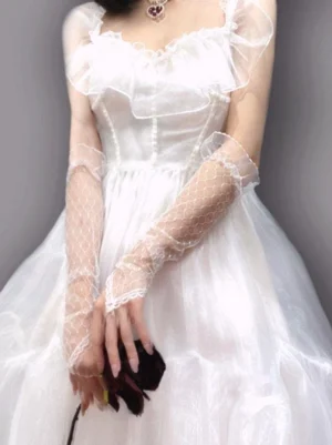 White lolita ruffled oversleeves front three-quarter view on model wearing white frilly wedding dress with sheer mesh fabric and ruffled wrist cuffs