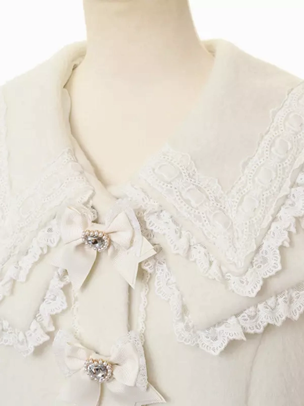 White sweet lolita coat side profile view showing long sleeves faux fur cuffs ruffled hem and overall princess coat structure