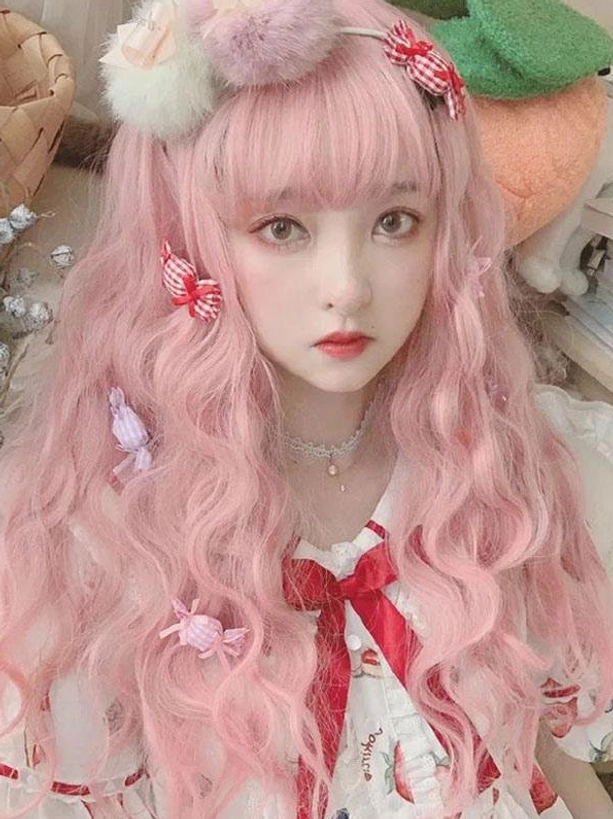 Light pink long wavy lolita wig full front view with air bangs and cute hair accessories perfect for sweet lolita fashion coordinate