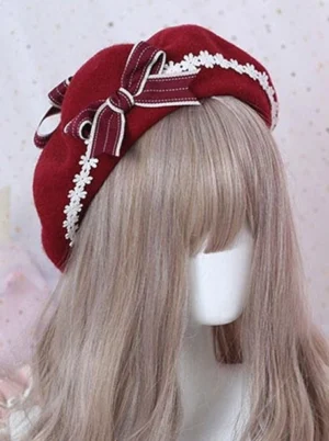 Sweet lolita wool beret with burgundy wine red color and white daisy lace trim, featuring double-striped plaid ribbon bow, side view on mannequin head with ash-blonde wig against starry pink backdrop