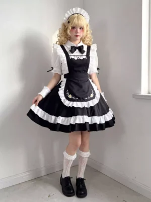Maid lolita costume featuring black dress, white ruffled trim, coordinating maid headdress, and lace socks with platform loafers full front view