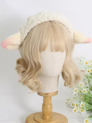 Sweet pink lamb ear beret handmade sherpa Lolita hat front left angle view on blonde mannequin with daisy flower backdrop
