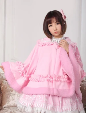 Sweet pink lolita cloak with Peter Pan embellished collar front three-quarter view showing ruffled trim and fuzzy fleece edge details on model wearing lolita fashion