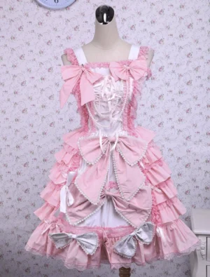 Sweet pink cotton Lolita JSK jumper dress with layered ruffles, tiered design, front full view on mannequin displaying soft pink and white colors with decorative bows and lace trim details