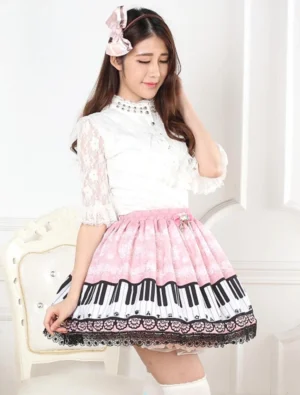 Pink piano key lolita skirt side three-quarter angle showing flared A-line silhouette with elastic waist design and model wearing pink bow accessory