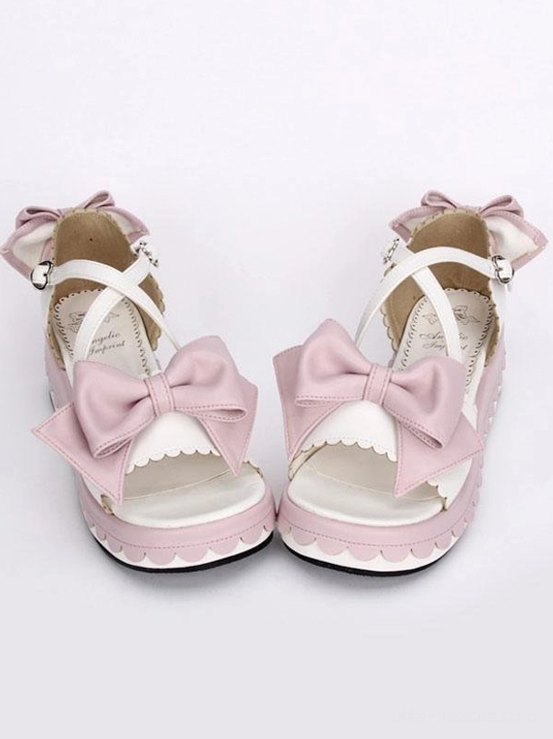 Sweet pink and white lolita platform sandals with dual front bows and scalloped platform sole, direct frontal view on white background