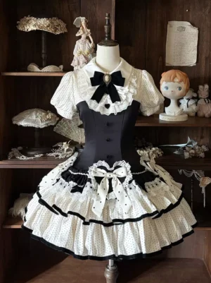 sweet polka dot black white lolita dress front full view short puff sleeves tiered ruffle skirt velvet collar bow cameo brooch