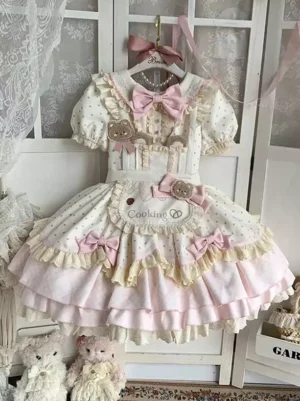 Sweet polka dot lolita OP dress short sleeve front view ecru white with pink ruffle trims bow accents baby doll style vintage aesthetic