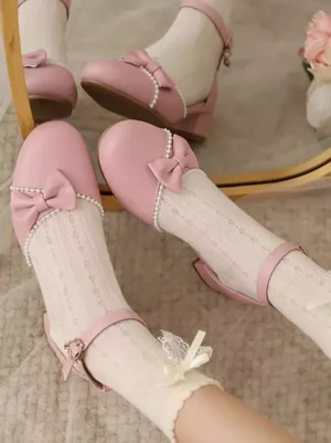 Sweet Rococo lolita pumps pink chunky heel with pearl trim bow detail ankle strap close-up mirror reflection ruffled lace socks
