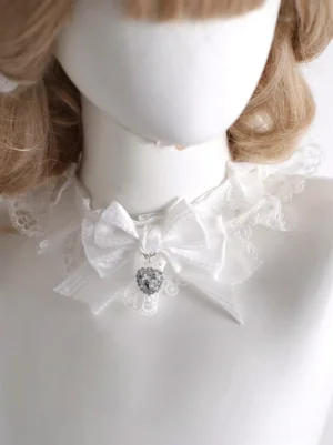 Sweet white lace choker with satin bow and heart crystal pendant worn on mannequin front close-up view lolita rococo neckwear