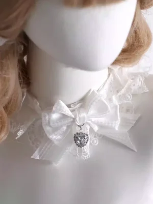Delicate lace ruffled choker with shiny satin bow and hanging heart crystal gem three-quarter view lolita accessories