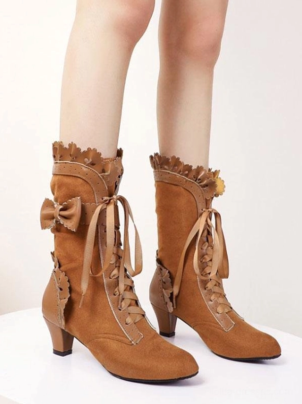 Tan brown suede lolita boots with scalloped ruffled cuff and bow ornament lace-up ties front wearing