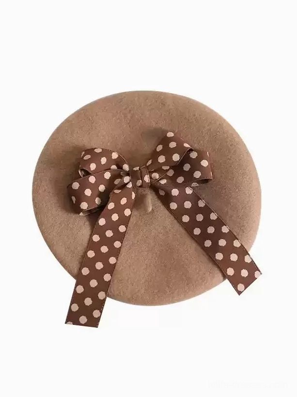 tan lolita beret with brown polka dot bow flat lay top-down view product photography