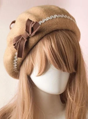 Sweet Lolita wool beret in tan color with white ricrac trim and brown fabric bow front view on mannequin