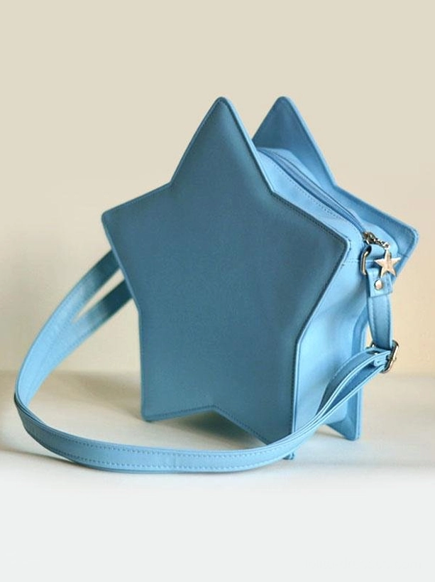 Teal blue star-shaped lolita crossbody bag three-quarter side-back view showing star-shaped metal zipper pull matching shoulder strap and matte leather exterior