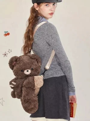 Sweet lolita teddy bear plush bag in dark brown corduroy with beige crossbody strap casually worn by model in casual coordinate
