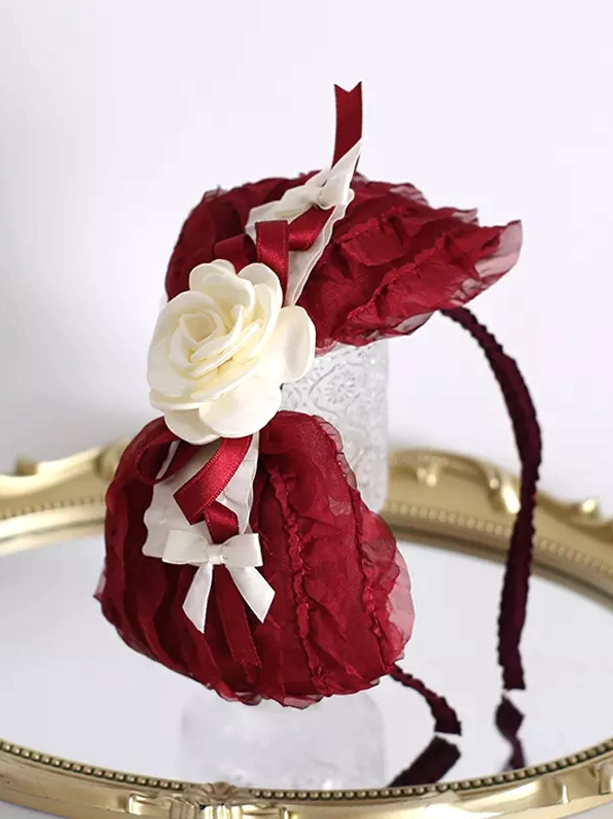Sweet lolita headdress with wine red chiffon bows white mini bows and rose embellishment front side display on elegant stand