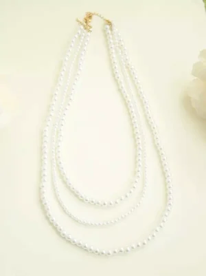 triple-strand white pearl necklace sweet lolita tea party accessory gold clasp flat lay studio view