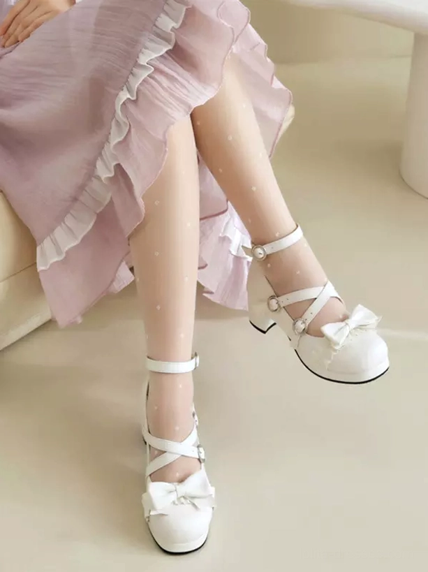 Two-tone Lolita chunky heel pumps low side view featuring cross ankle straps, block heel, and front bow embellishment, styled with polka dot white socks and ruffled pink skirt