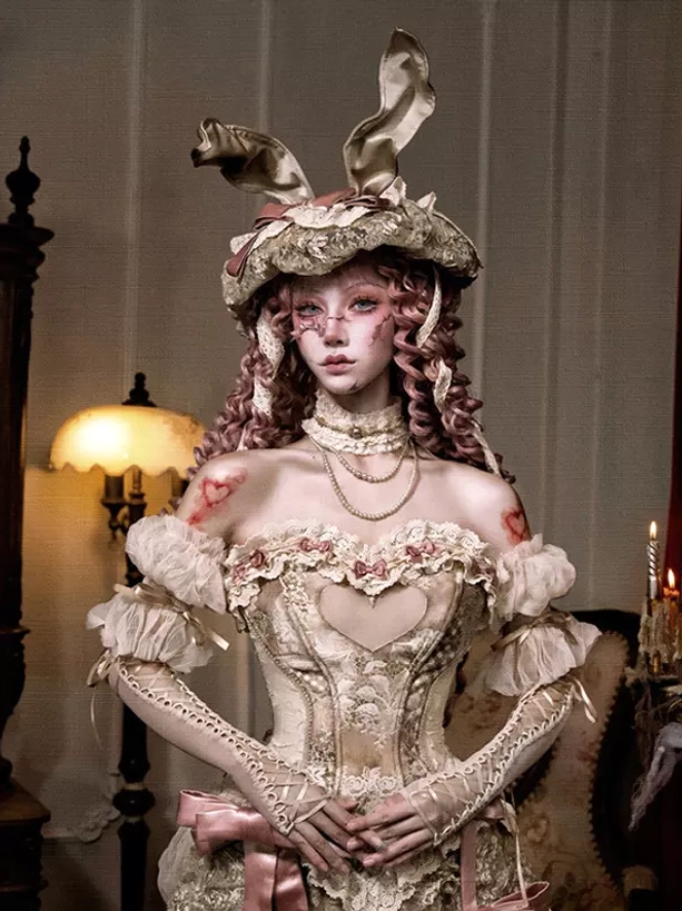 Vintage Victorian lolita outfit styled with cream arm sleeves heart cutout corset off-shoulder ruffled sleeves close-up detail