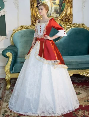 Victorian Lolita maid costume dress side perspective showing 3/4 length bell sleeves with lace cuffs, red buttons, square neckline, and layered lace skirt, worn by model on velvet sofa