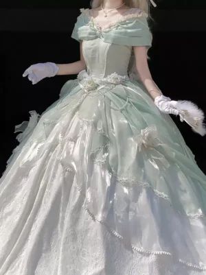 Vintage off-shoulder mint green and white lolita ball gown with ruffled trims and floral details worn by female model with white gloves