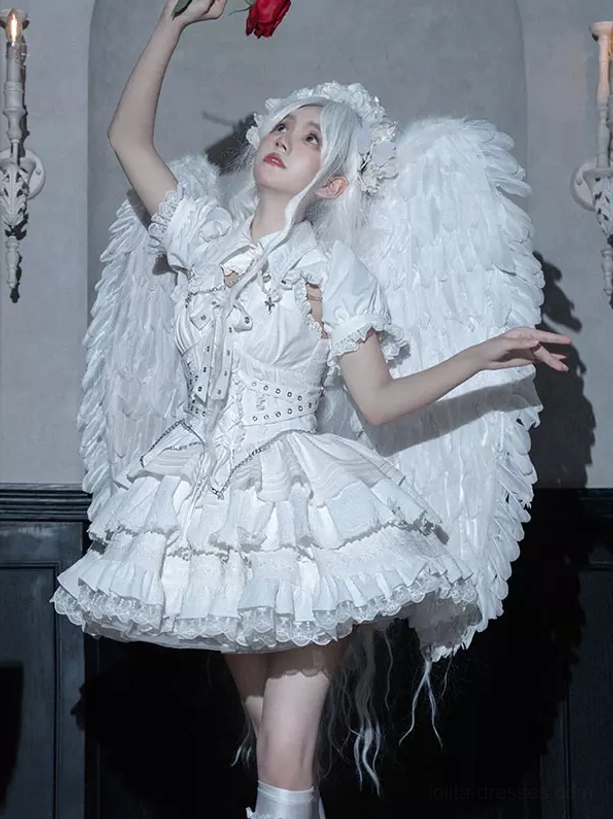 White angel style gothic lolita dress with corset waist ruffled skirt cross decorations and puff sleeves worn by female model with wings
