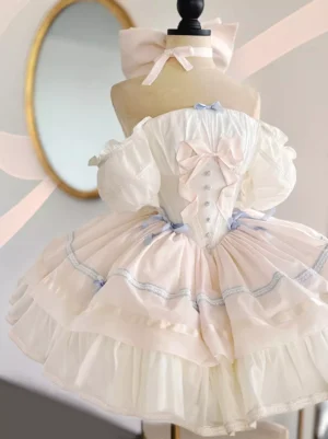 White ballet sweet lolita dress with off-shoulder puff sleeves ruffled skirt and pink bows front view on dress form