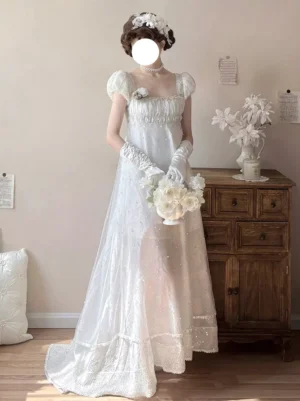 Sweet lolita white fairy dress with ruched bust detail, beaded tulle fabric, and delicate lace gloves - front full-body shot showcasing brooch and bridal bouquet styling