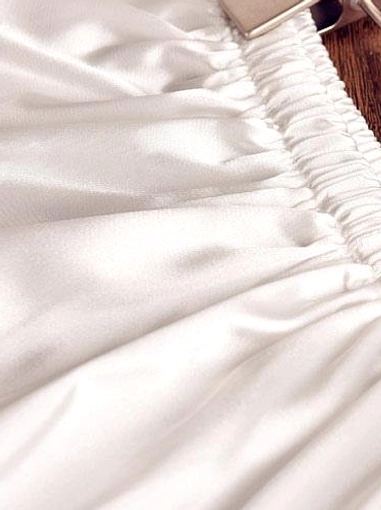 Close-up detail of white lolita bloomer elastic waistband and gathered construction, showing soft satin fabric and elastic waist engineering for comfortable fit
