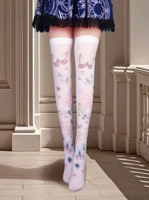 Front view of white sheer thigh high Lolita socks featuring butterfly and floral watercolor prints on model's legs