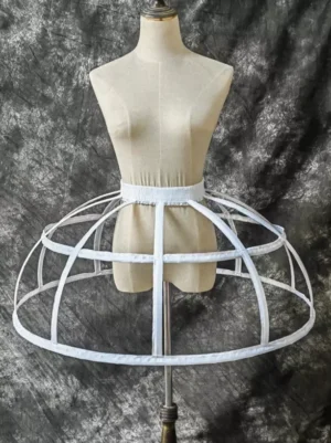 White cage crinoline petticoat front view flat lay on dress form mannequin showing open metal hoop frame structure and elastic waistband for lolita ball gown underskirt