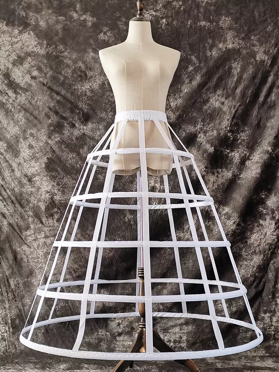 White cage petticoat front full view with bright open framework structure against dark velvet background