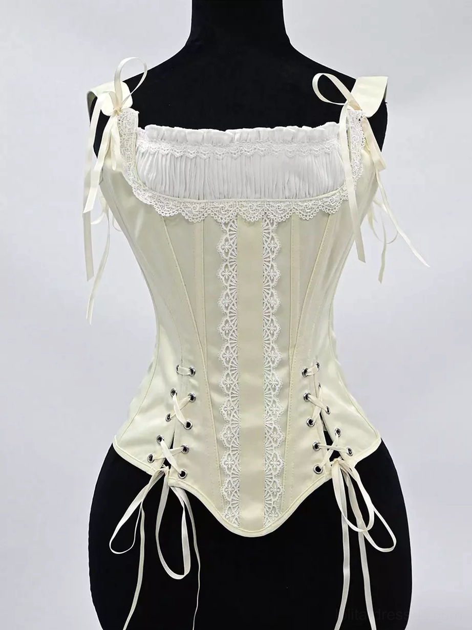 Satin corset bustier close-up detail view of front lace-up closure system with metal eyelets, ruched lace trim at neckline, and polyester satin fabric texture
