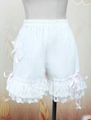 white cotton lolita bloomers left rear three-quarter view heart pocket pink bow lace ruffle hem pink satin ribbon dress form