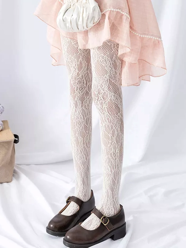 White botanical vine embroidered fishnet lace tights front view with pink ruffled skirt and brown Mary Jane shoes