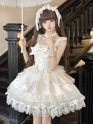 White fairy lolita sleeveless jsk dress with layered chest bows and feathered parasol front half-body view