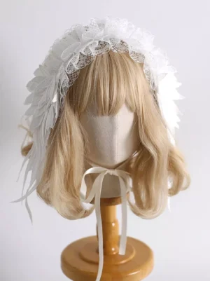 White feather frilled Lolita headdress front overhead view showing delicate lace trim and embroidered feather accents with white ribbon tie on mannequin display
