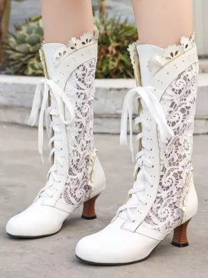 white lace lolita mid-calf boots with scalloped collar and round toe on model in garden setting