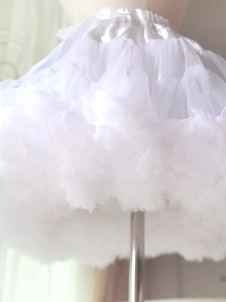 White fluffy lolita petticoat close-up side view metal display stand pure white ultra-voluminous ruffled tulle layers