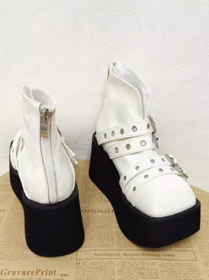 Gothic lolita platform boots showing rear zipper design, silver hardware details, thick black wedge sole, and structural side profile