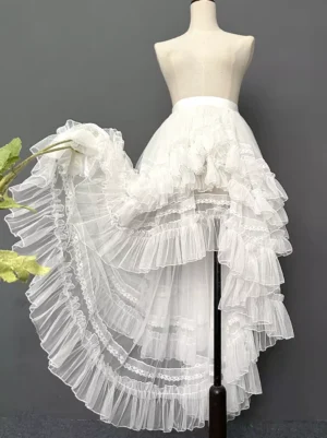 White Gothic Lolita detachable high-low tiered train skirt with lace ruffles, rear left three-quarter view on dress form showing layered tulle construction