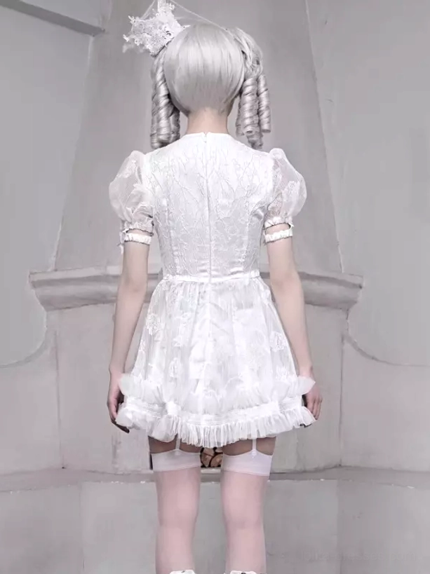 White Gothic Lolita Dress Back View Full Length - Puff Lace Sleeves and Ruffled Skirt Hem with Fireplace Background
